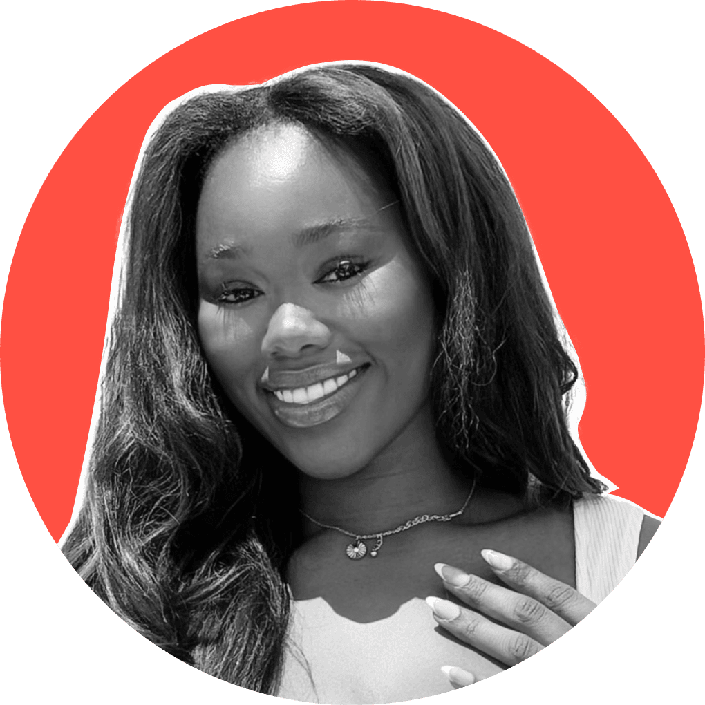A young black woman smiling confidently at the camera.