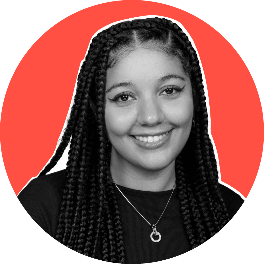 A young black woman smiling confidently at the camera
