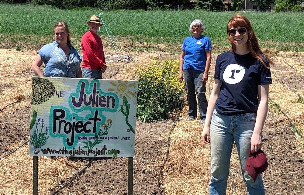 Jen is outdoors in the sun, volunteering for the Julien Project