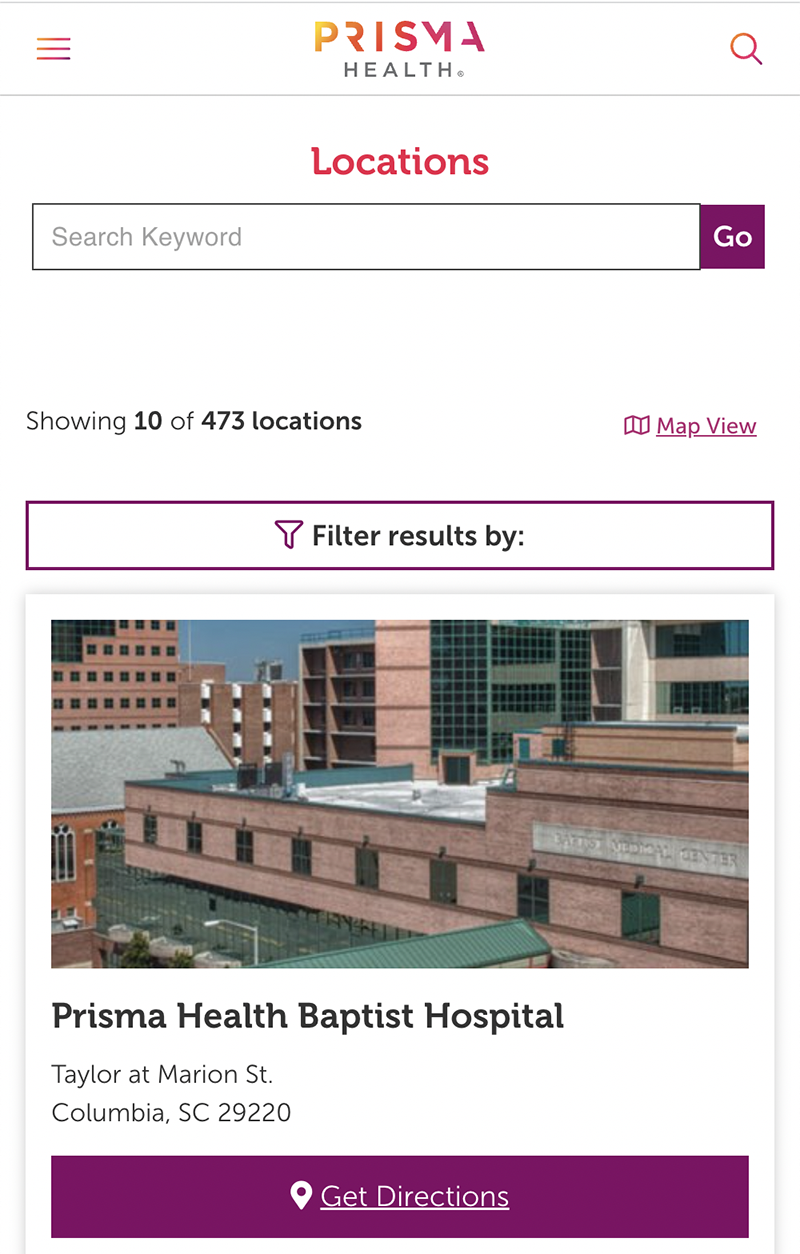 Screenshot of Prisma Health's locations as viewed on mobile, showing a picture of Prisma Health Baptist Hospital, along with its address and a "Get Directions" button. 